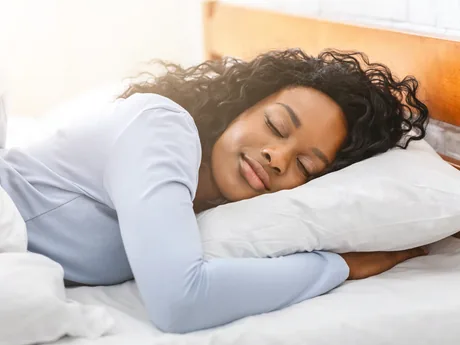 A woman sleeping peacefully in bed
