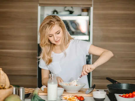 A woman preparing fresh food in her kitchen